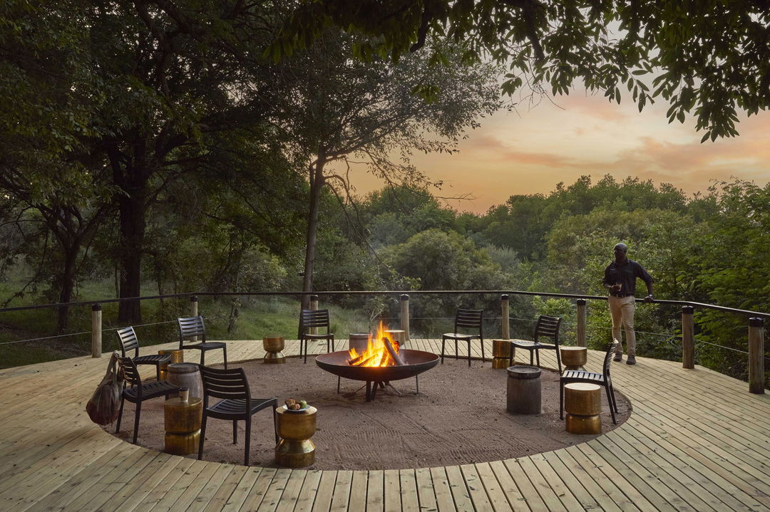 firedeck view of Tinga lodge Lion sands at sunset