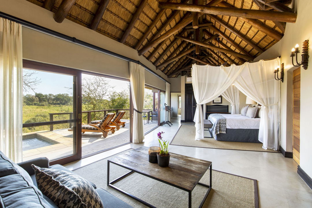 view of Tinga lodge suite bedroom at lion sand reserve