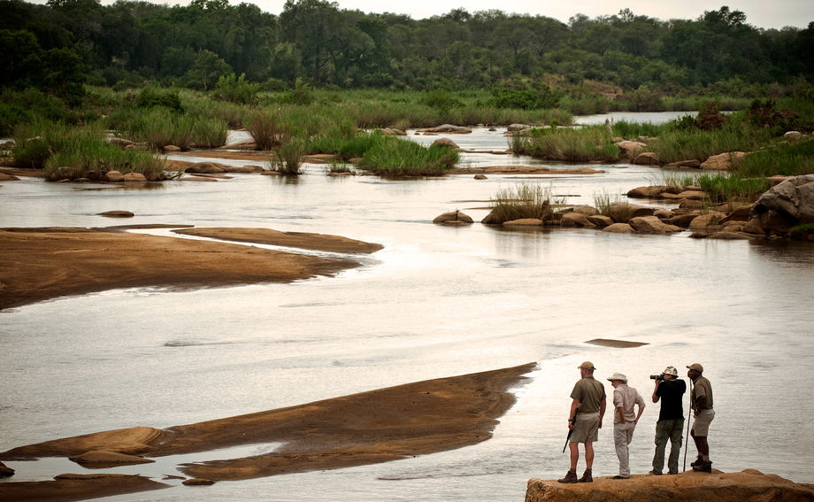 guides and guests on a river safari at Lion Sands Game Reserve guides and guests on a river safari at Lion Sands Game Reserve