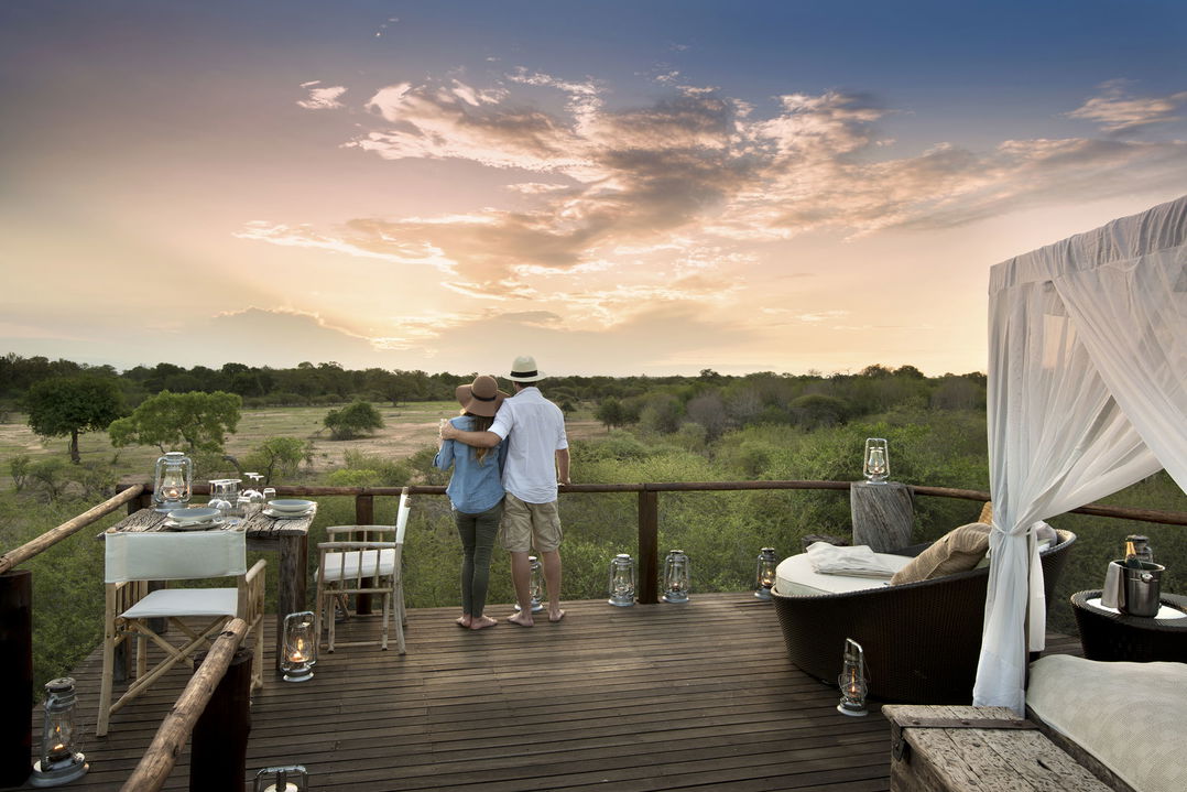 guests on deck of treehousat Chalkey Lion Sands Game Reserve