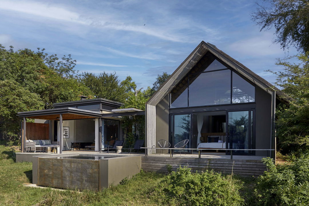 exterior view from river of suite at Ivory Lodge Lion Sands Game Reserve