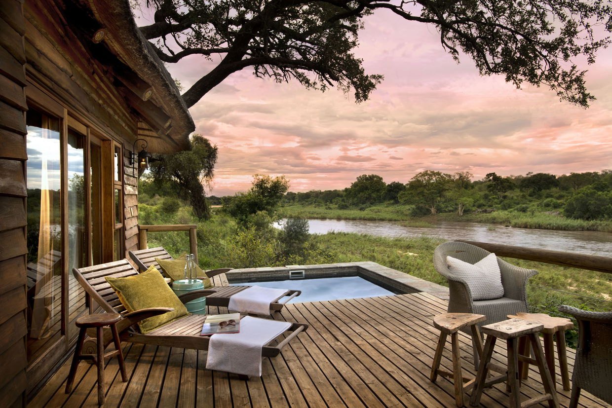 splash pool on deck at sunset by Nerina Lodge Lion Sands Game Reserve