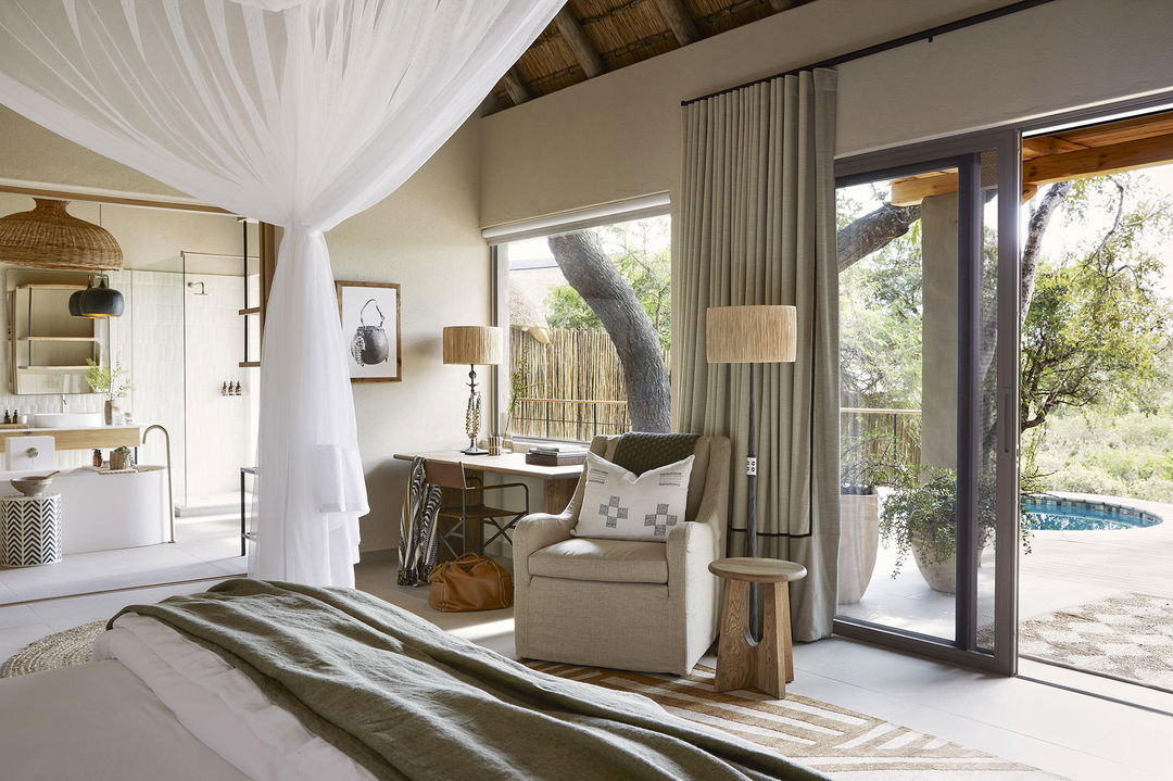 bedroom and deck view of superior chalet at Founders camp Londolozi