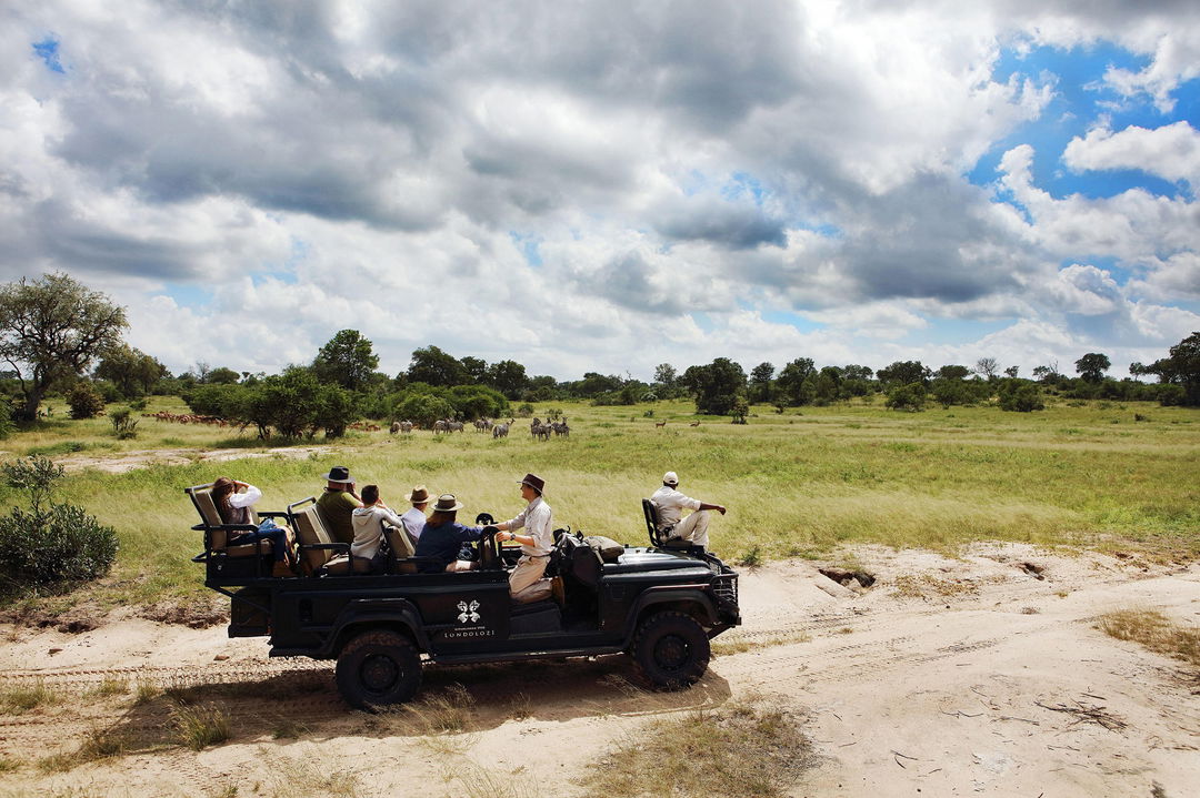 game drive activity with guests on open vehicle at Londolozi