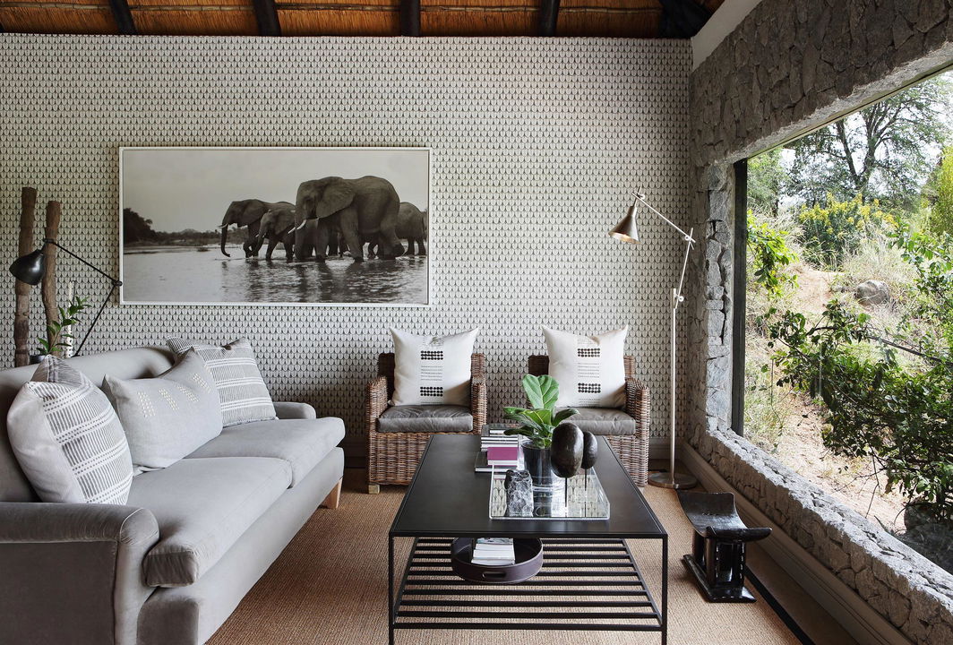 granite suites room lounge area with view at Londolozi