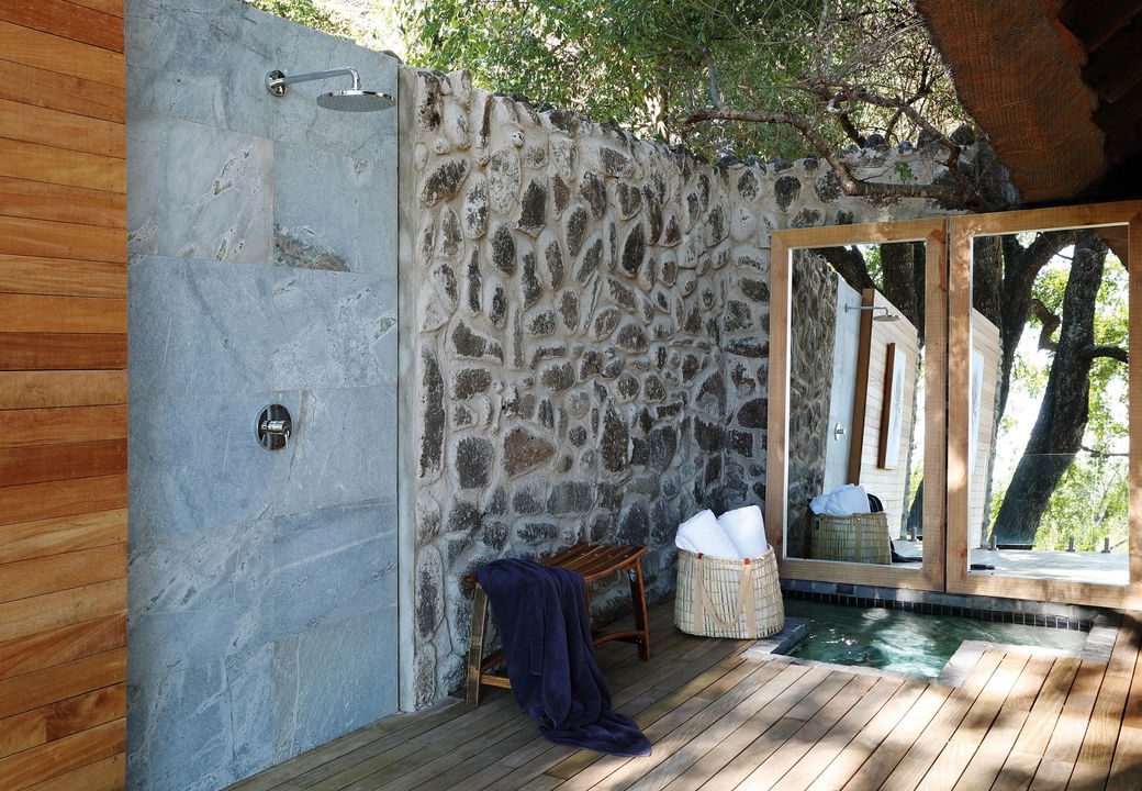 outdoor shower with mirror on deck by healing house spa Londolozi