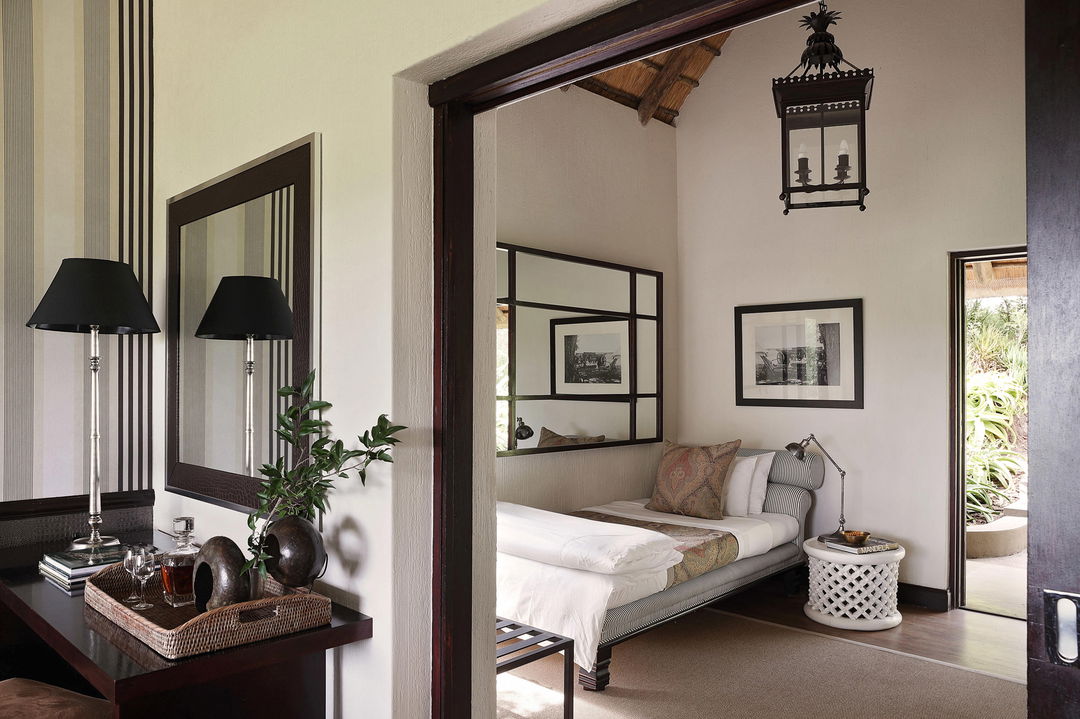 view of the bedroom and writing desk at pioneer camp Londolozi