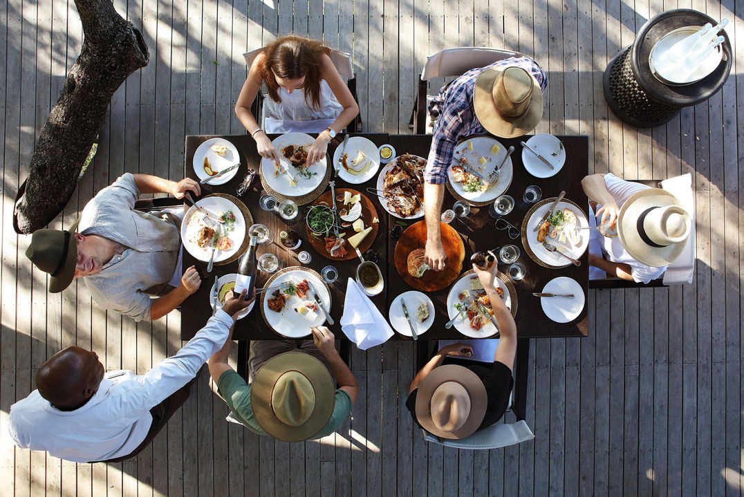 guest having lunch on the deck at pioneer camp Londolozi