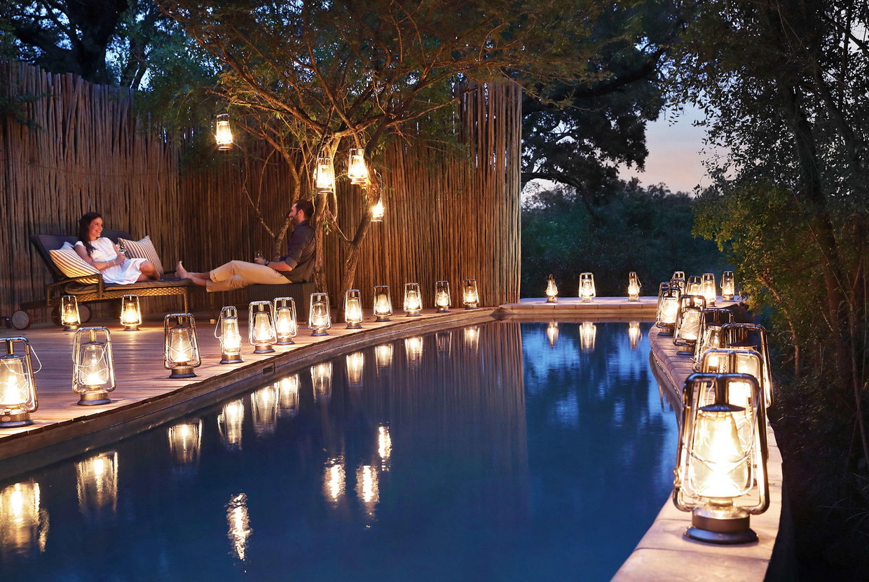 guest at sunset by the pool of pioneer camp Londolozi