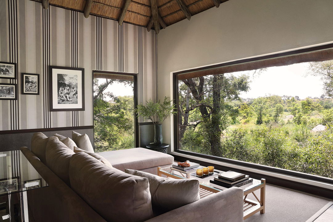 lounge with big viewing window in suite of Pioneer camp Londolozi