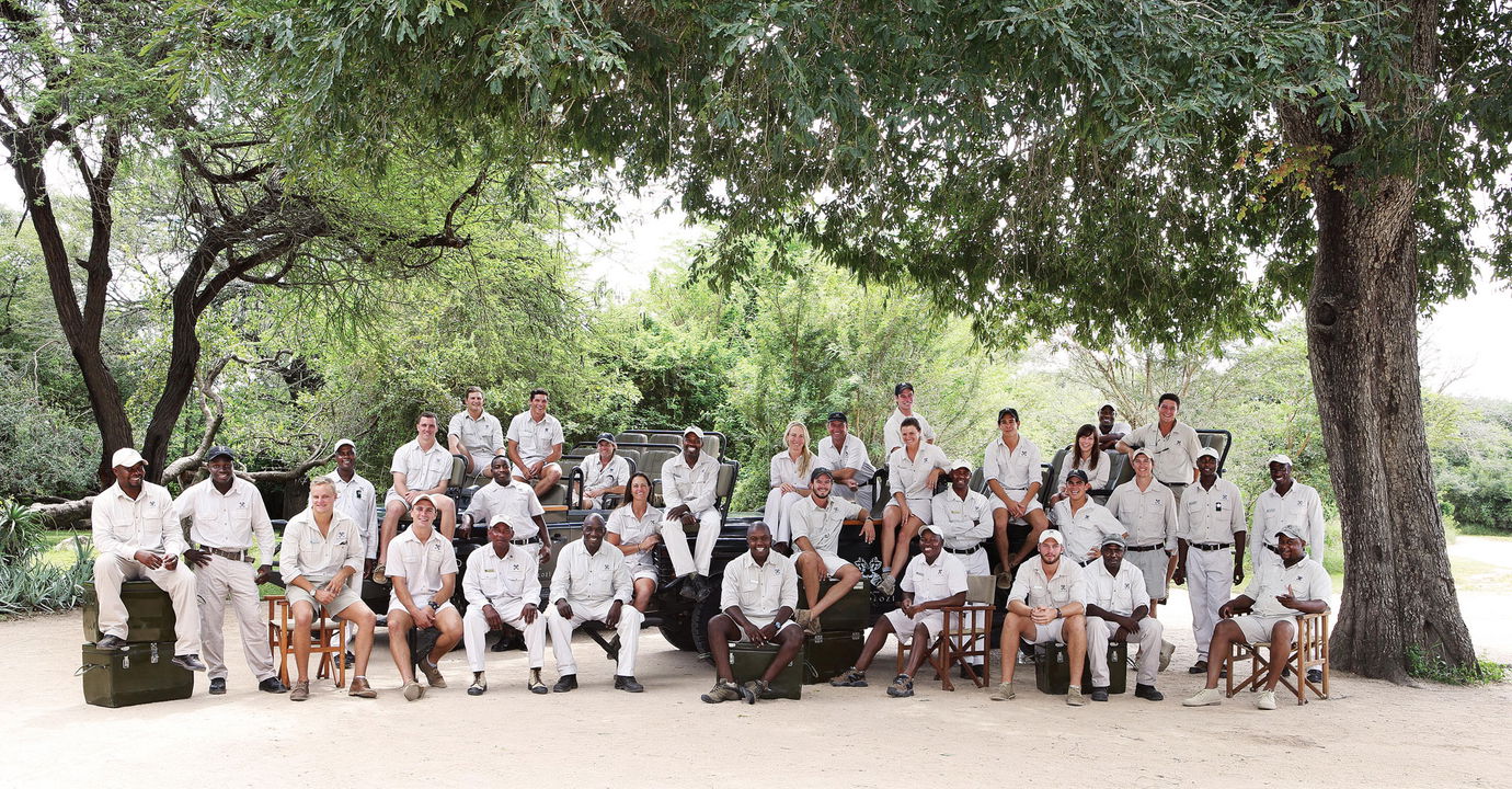 group photo of all the trackers and rangers at the Londolozi game reserve camps