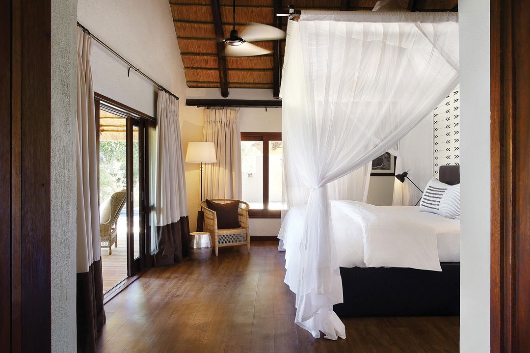view of bedroom and deck at tree camp Londolozi