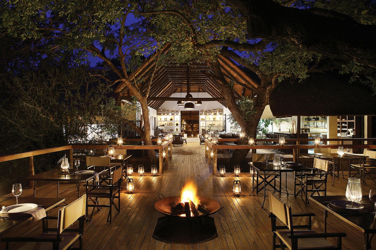 illuminated view of the main deck at night buy Londolozi Tree camp