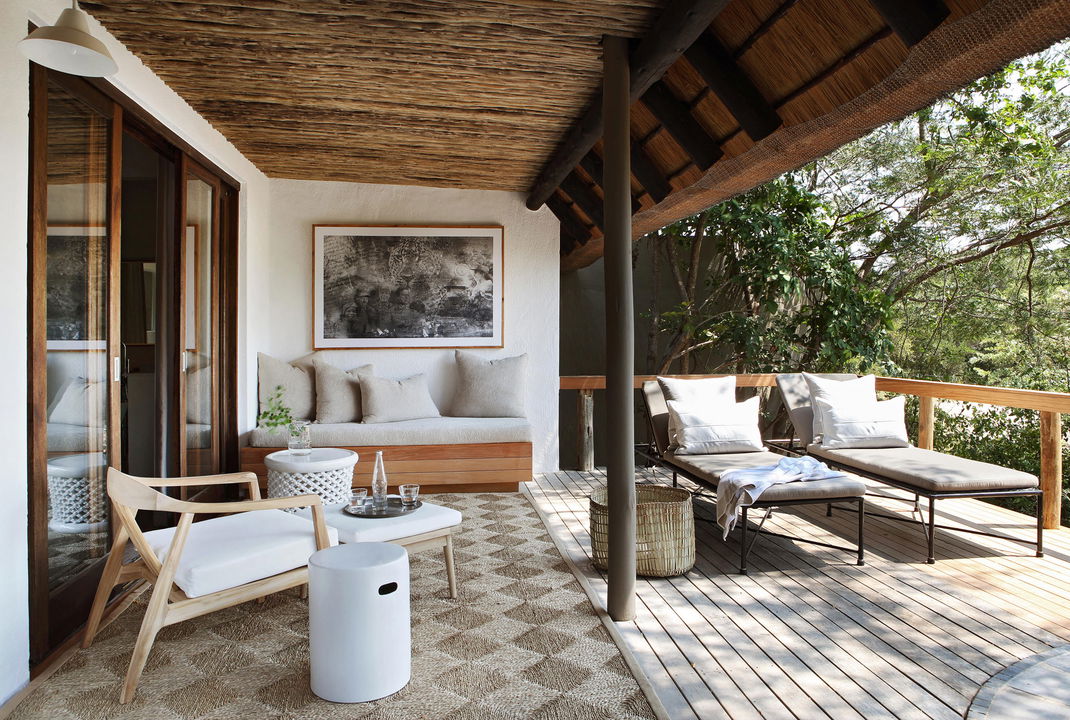 bedroom and deck view of suite at Varty camp Londolozi game reserve