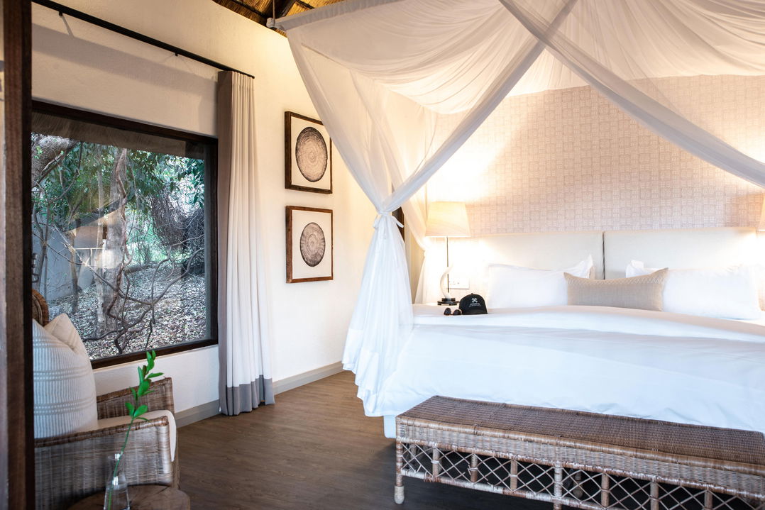 bedroom of superior chalet at Varty camp Londolozi game Reserve