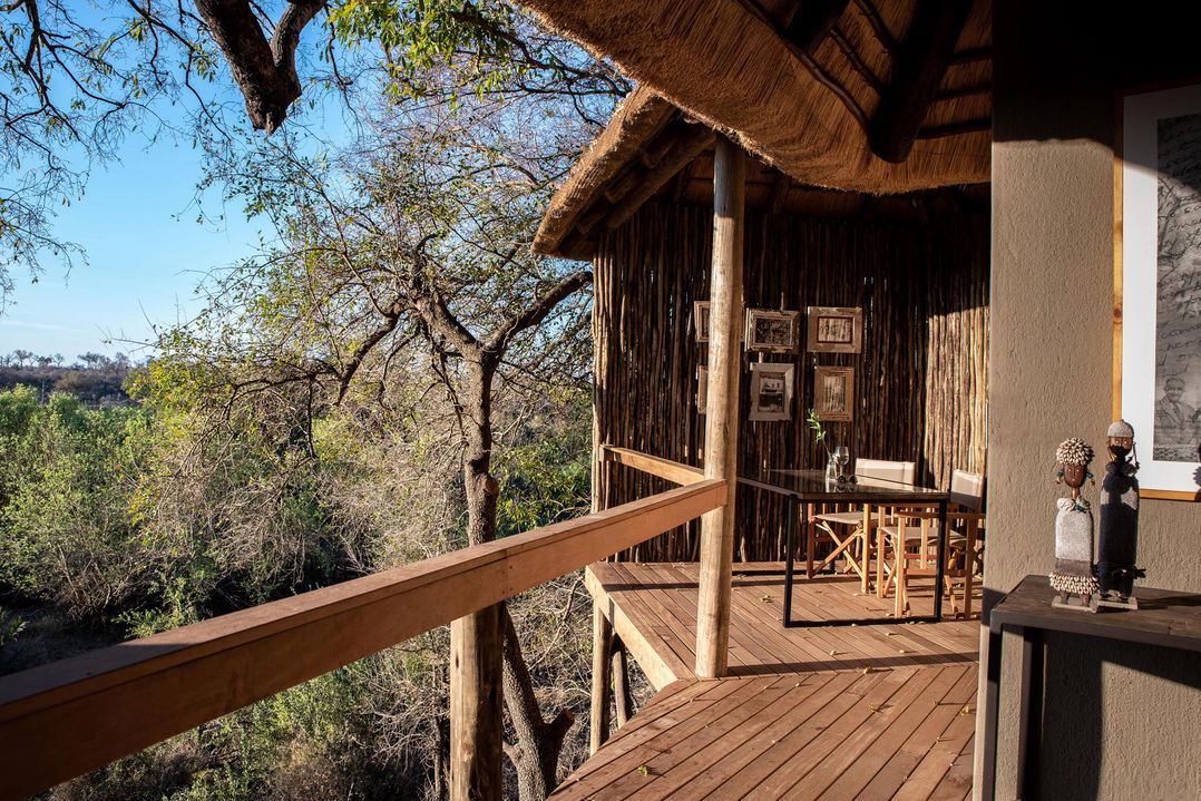 deck in morning sun of superior chalet at Varty camp Londolozi Game Reserve