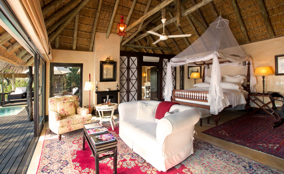 interior view of luxury suite with red carpet at Royal Malewane lodge