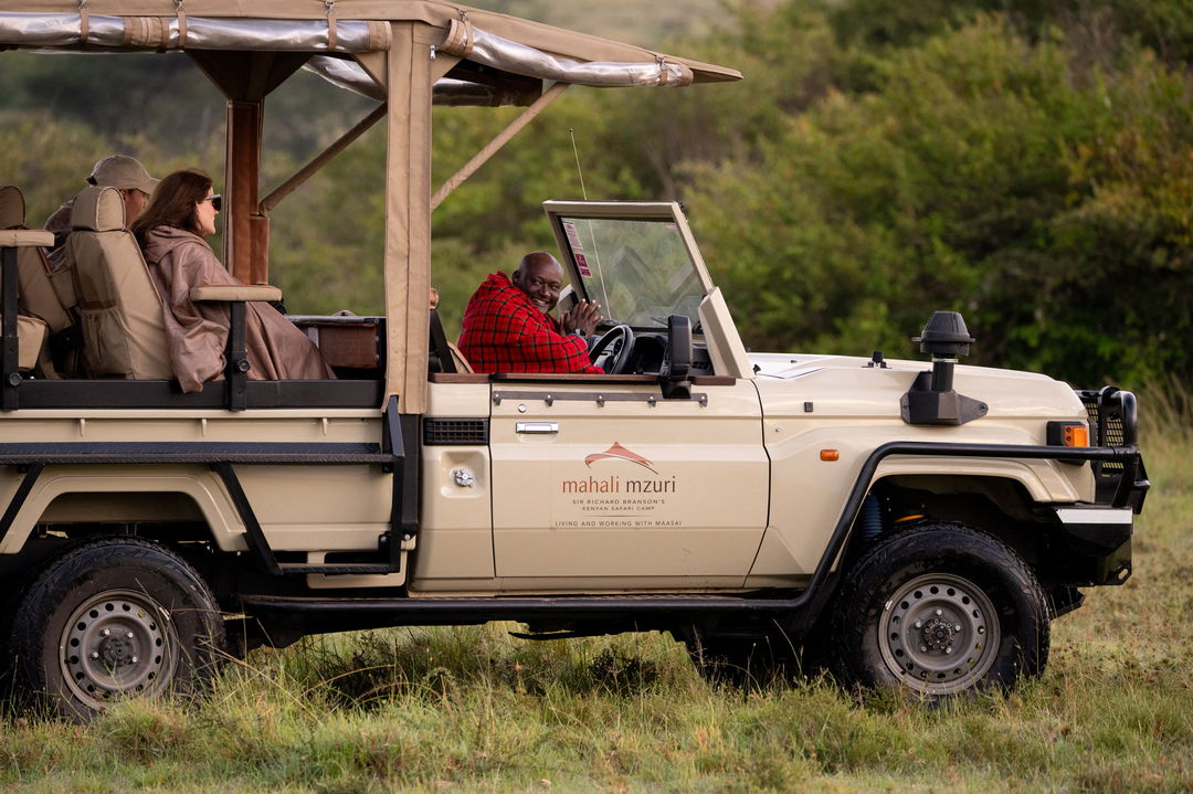 guests on a safari vehicle on a game drive at Mahali Mzuri Kenya Masai Mara