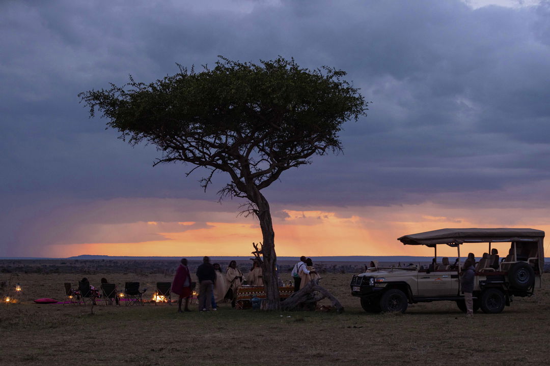 sundowners under a tree on the plains of Mahali Mzuri Kenya Masai Mara