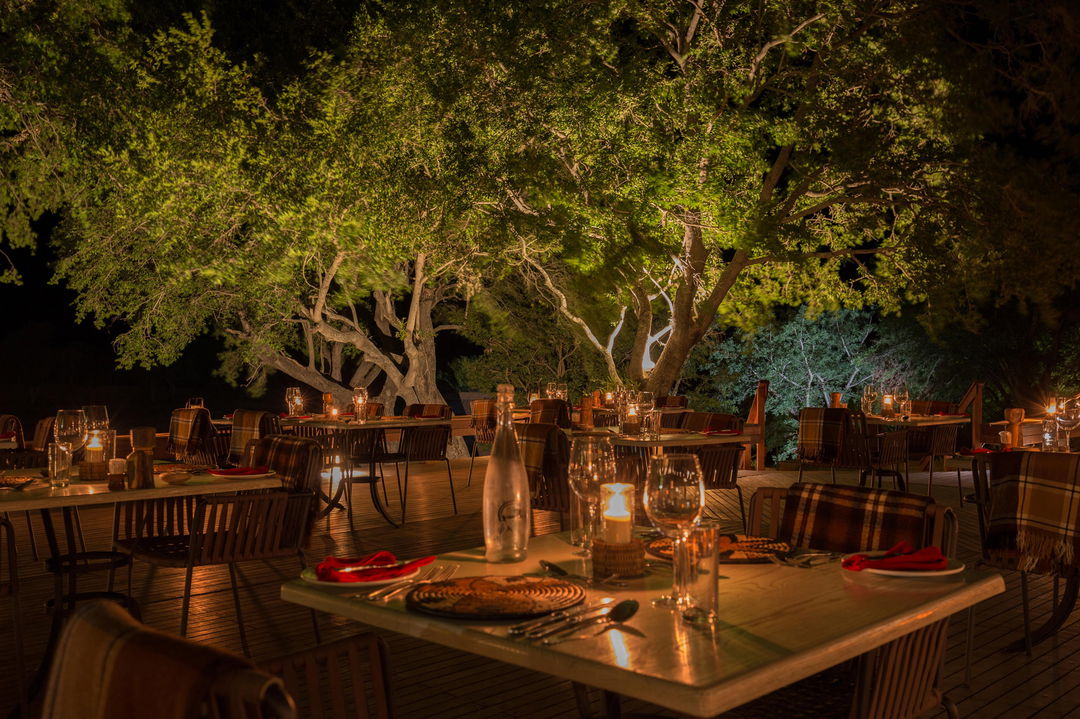 deck with supper setting at night at MalaMala Main Game lodge