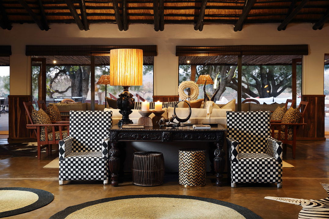 reception area with chairs and table at MalaMala Main Game lodge