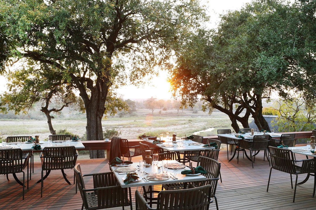 morning view of deck at MalaMala Main Game lodge set for breakfast
