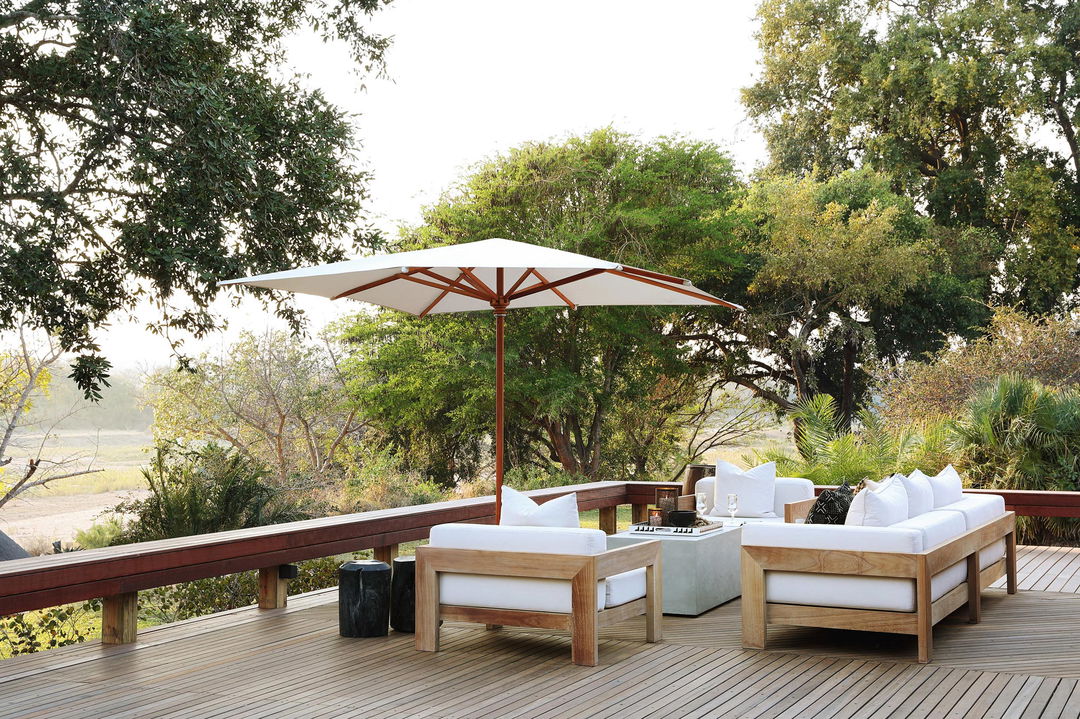 parasol with couches on viewing sun deck at MalaMala Main Game lodge