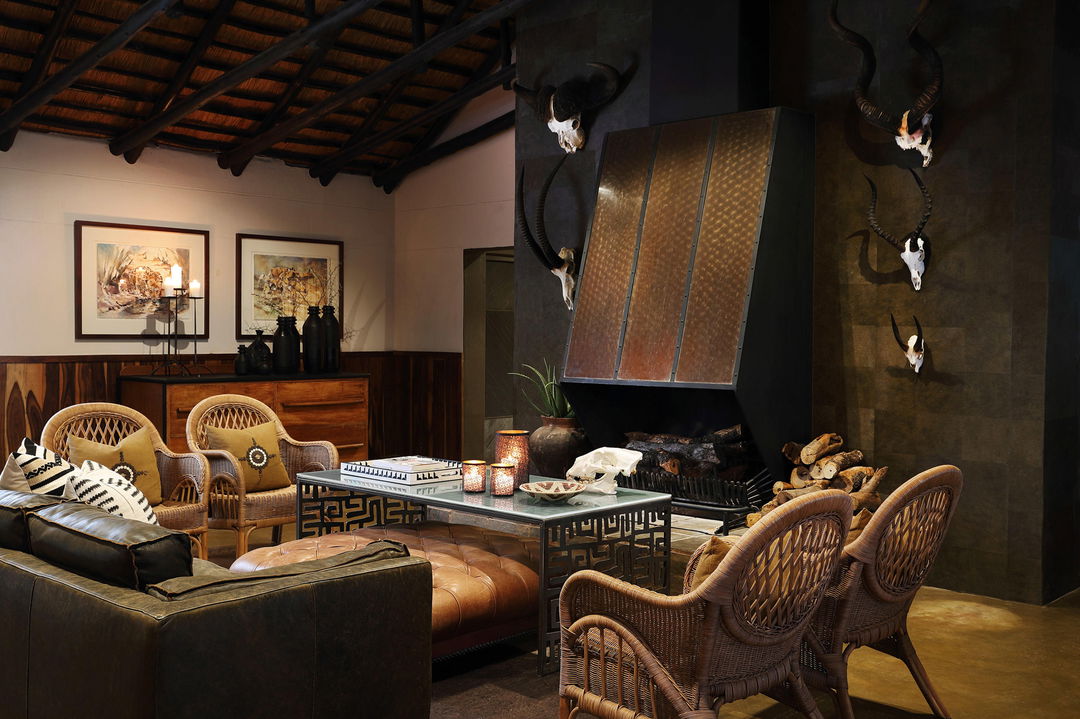 fireplace and lounge area of main lodge at MalaMala Main Game lodge
