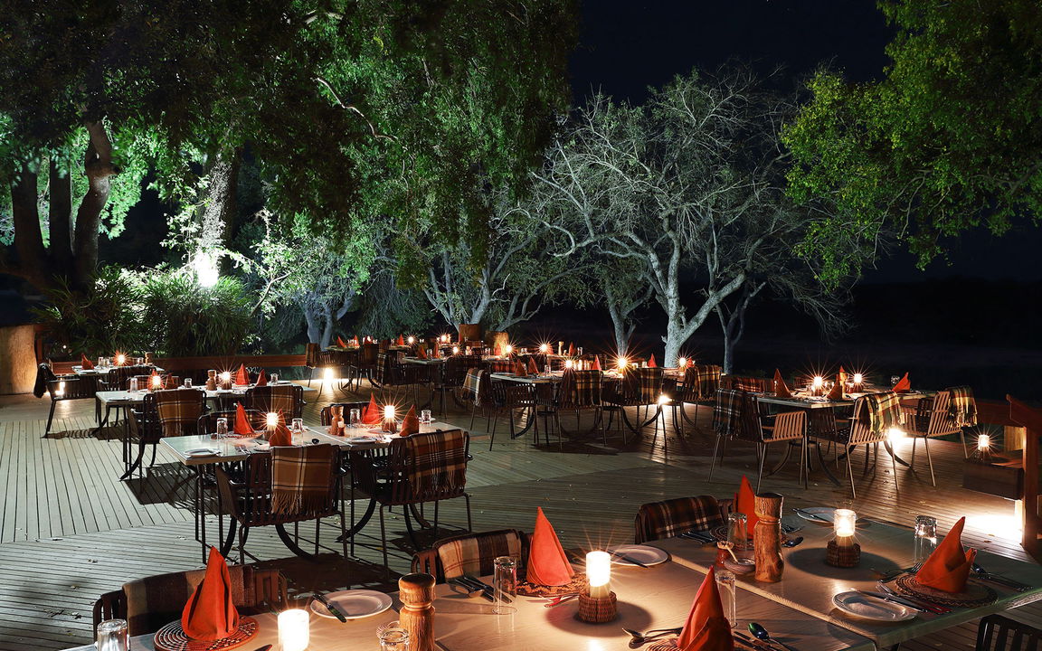 fireplace boma set for supper at night by MalaMala Main Game lodge