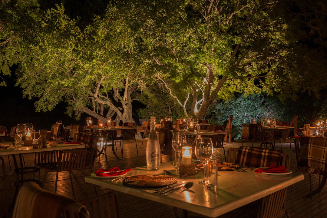 deck with supper setting at night at MalaMala Main Game lodge