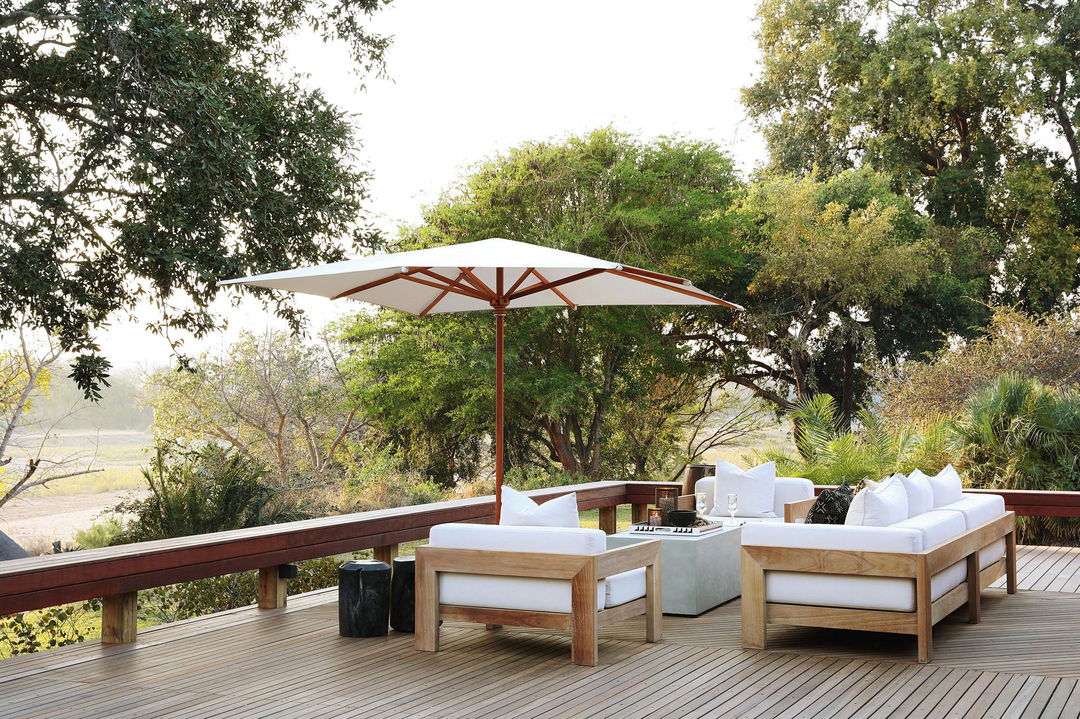 parasol with couches on viewing sun deck at MalaMala Main Game lodge
