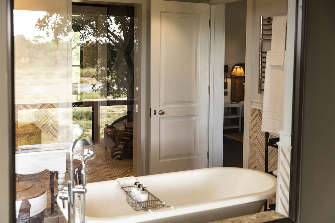 bathtub in bathroom of suite at MalaMala Rattrays camp