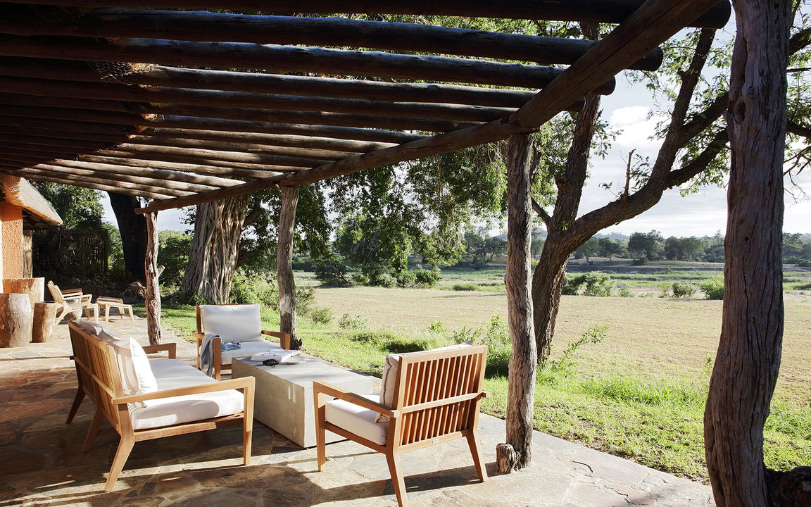 veranda setting with table and chairs outside suite of Sable Camp MalaMala