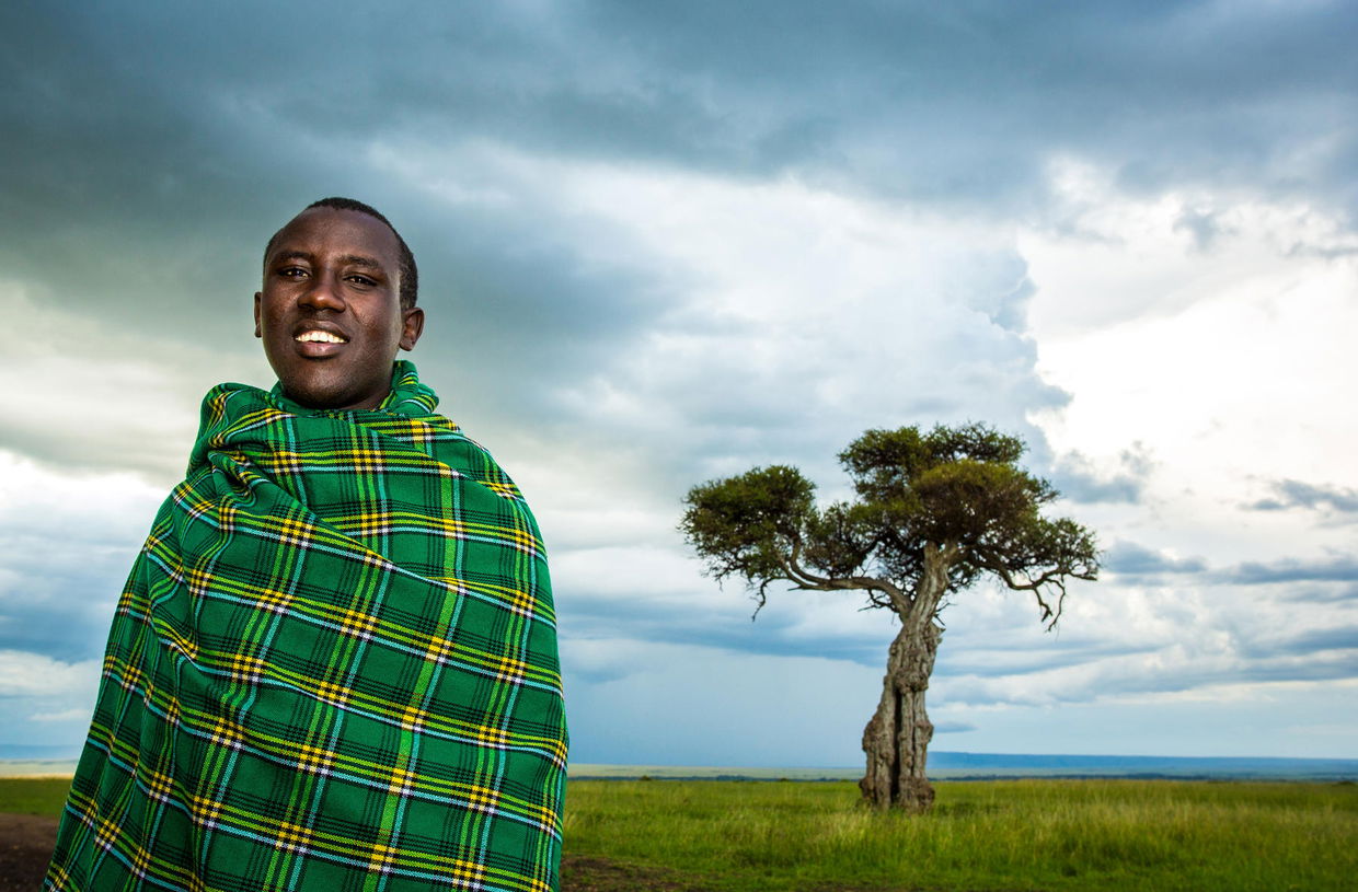 Masai guide on plains of Mara plains camp Kenya Masai Mara