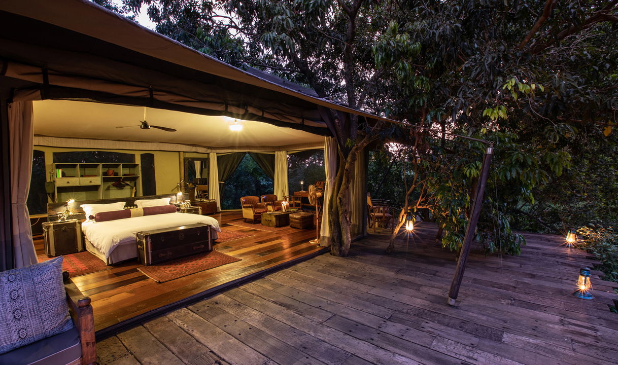 view of bedroom from deck at night by Mara Plains Camp Kenya Masai Mara