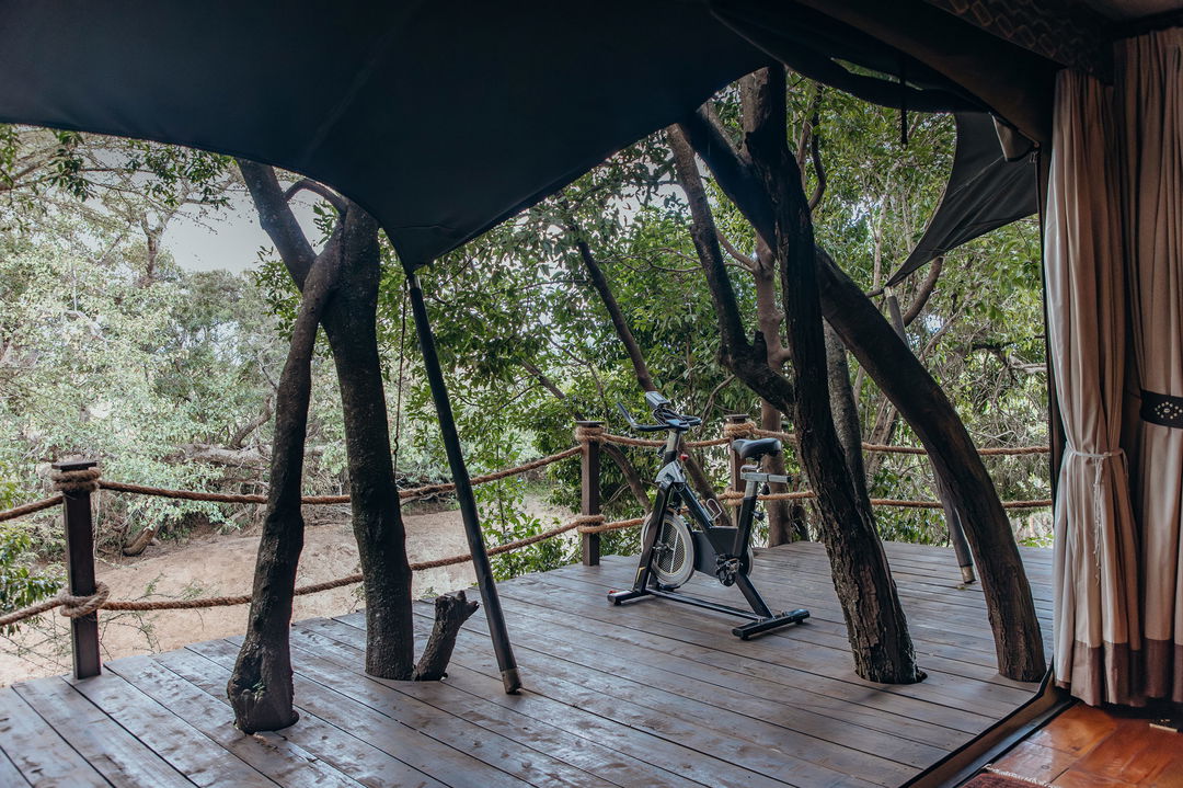 exercise bike on deck of suite at Mara Plains Camp Kenya Masai Mara