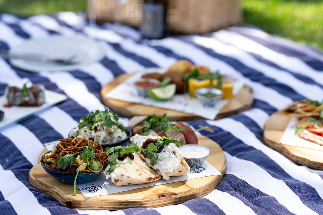 cheese platters on a picnic blanket at Mont Rochelle Wine Estate