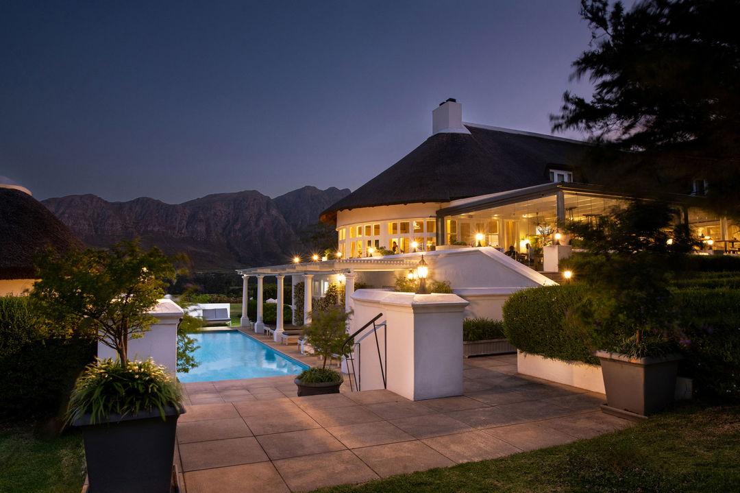 exterior dusk view of the illuminated facilities of Mont Rochelle Wine Estate