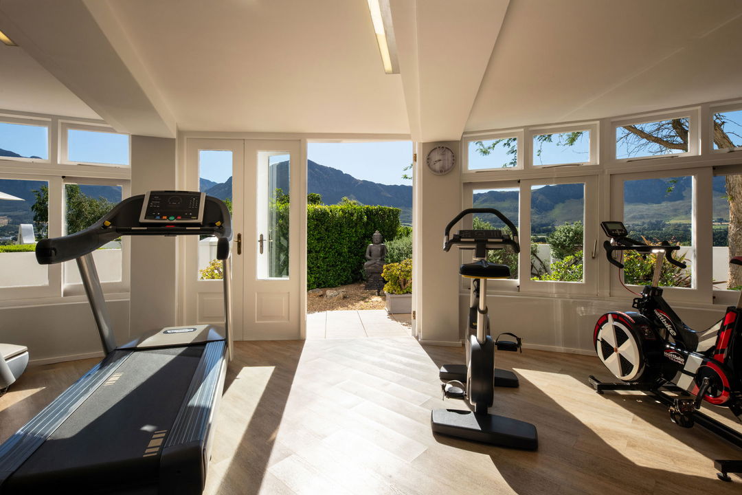gym with mountain views in the morning sun at Mont Rochelle Wine Estate