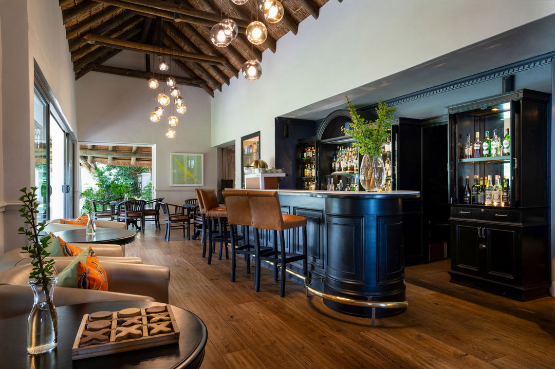 cocktail bar area with chairs  at Virgin Unlimited Mont Rochelle Luxury Hotel in Franshoek
