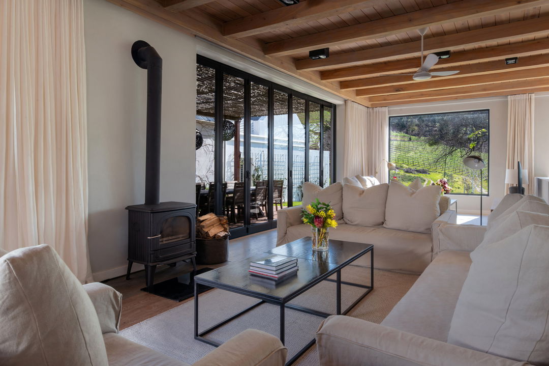 lounge with fireplace in a luxury suite of Mont Rochelle Wine Estate