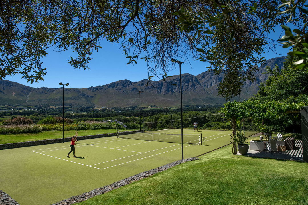 guests on the tennis courts of Mont Rochelle Wine Estate