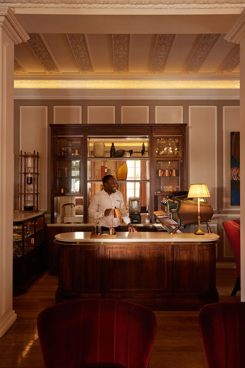 barman behind bar counter of Mount Nelson Hotel Cape town