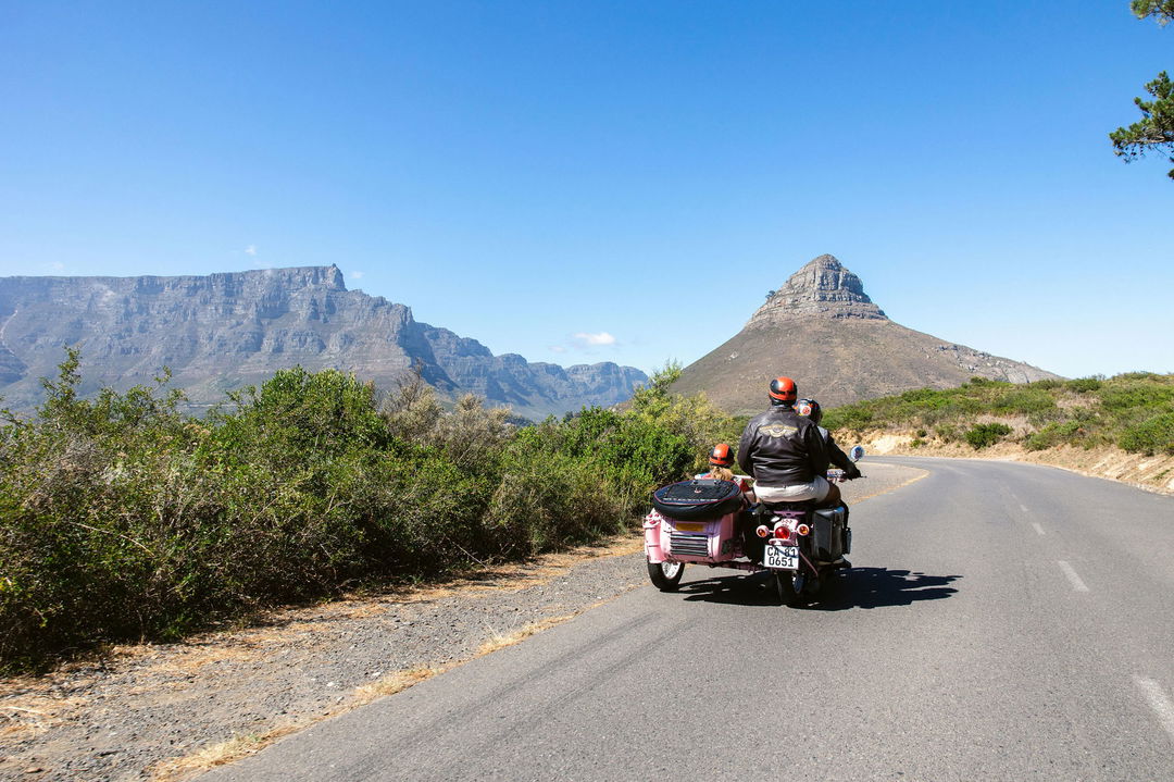 motorbike and side car cruising on road by Chapmans peak