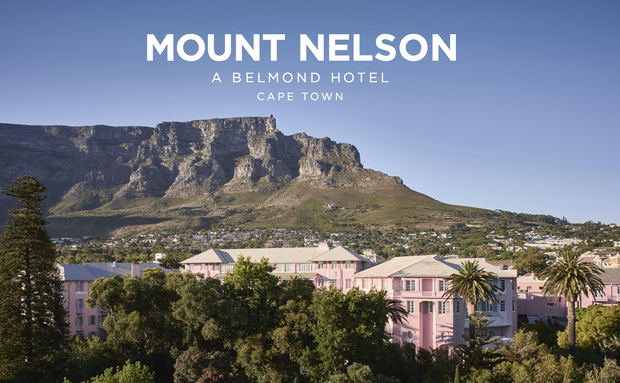 exterior view of the Mount Nelson Hotel Cape Town underneath table mountain in background with logo overlay exterior view of the Mount Nelson Hotel Cape Town underneath table mountain in background with logo overlay