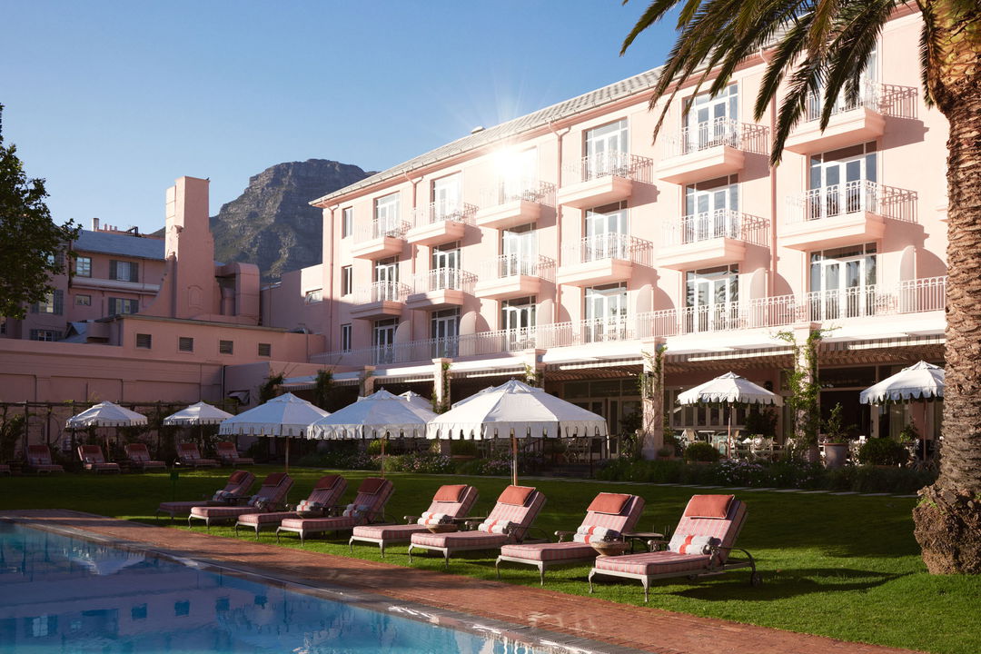 pool area with loungers and umbrellas at Mount Nelson hotel Cape Town