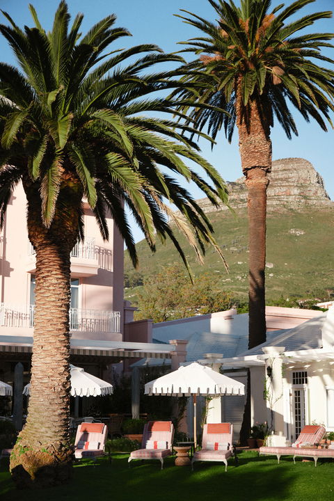 view of Lions head behind mount nelson hotel building in cape town