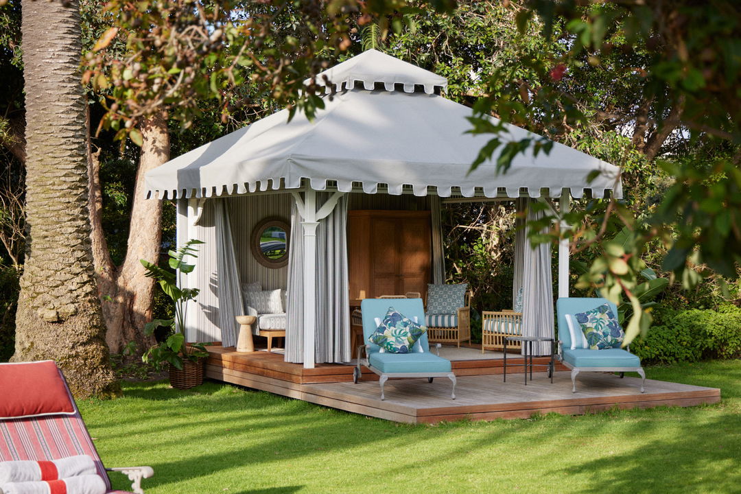 garden gazebo in victorian style on lawn loungers and drapes at Mount Nelson Hotel Cape Town