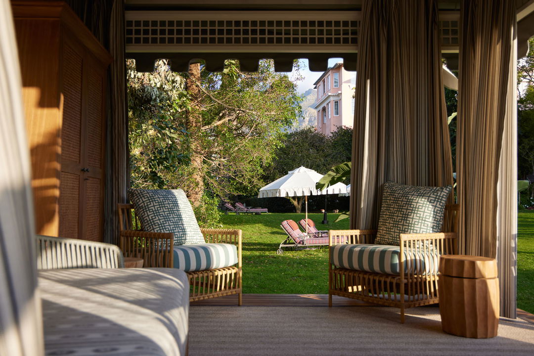 garden gazebo on lawn loungers and drapes at Mount Nelson Hotel Cape Town