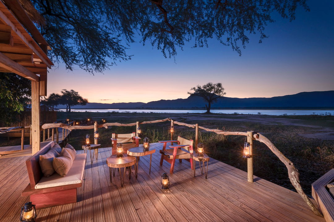 dinner setting at sunset on deck of Nyamatusi Camps Mana Pools Zimbabwe 